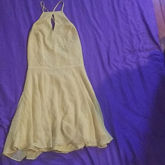 A yellow bebe mini dress, laces up in the back - Picture 2 of 4